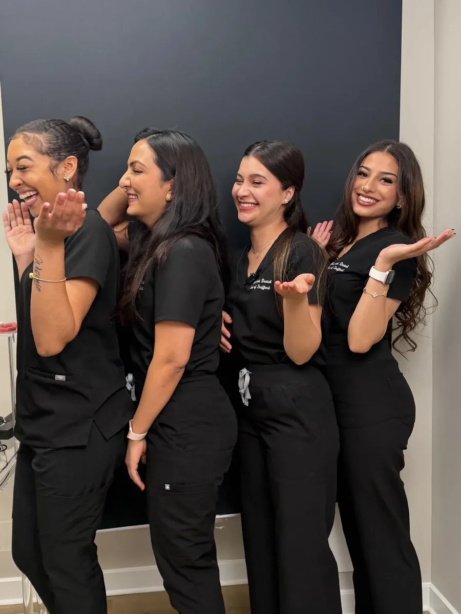 Team waving and welcoming patients