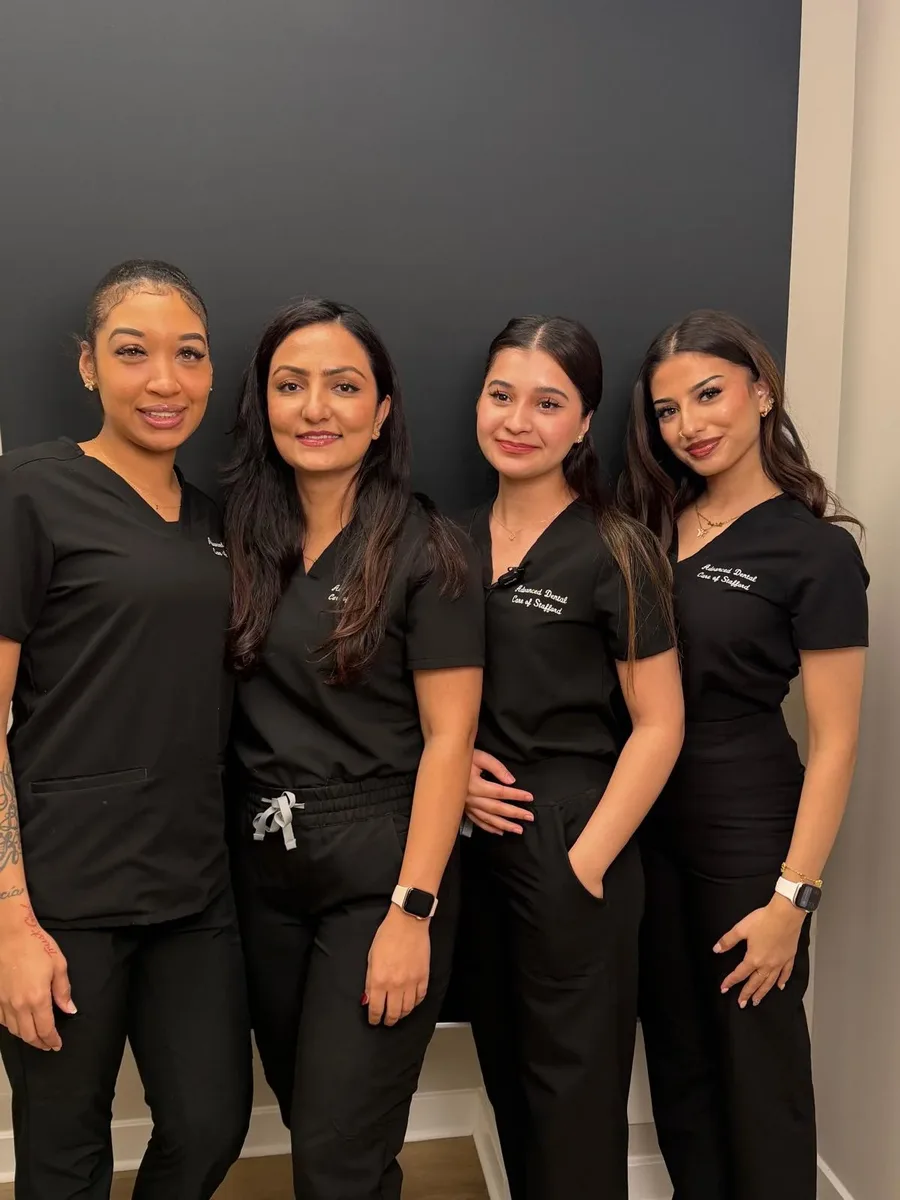 Our clinical team in matching Advanced Dental Care scrubs